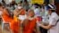 Health workers administer doses of the AstraZeneca COVID-19 vaccine to Buddhist monks at the Wat Srisudaram in Bangkok, Thailand, July 30, 2021.