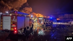 This handout photo taken and released by Ukraine's State Emergency Service on Dec. 28, 2024, shows firefighters putting out a fire after a Russian drone attack in Ukraine's Mykolaiv region.