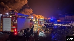 Firefighters work at the scene of a Russian drone attack in Ukraine's Mykolaiv region on Dec. 28, 2024. Ukraine says it struck a Russian storage and maintenance depot for drones on Saturday. (Ukrainian State Emergency Service via AFP)