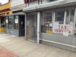 Shops once owned by African Americans sit empty on Georgia Avenue in Washington, D.C., illustrating the decline of small Black businesses across America. (Chris Simkins/VOA)