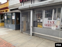 Shops once owned by African Americans sit empty on Georgia Avenue in Washington, D.C., illustrating the decline of small Black businesses across America. (Chris Simkins/VOA)