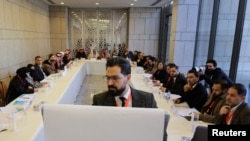 Attendees take part in a national dialogue, a key milestone in the transition to a new political system after decades of Assad rule, in Damascus, Syria, Feb. 25, 2025. 