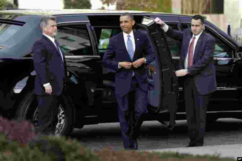 President Barack Obama smiles as he arrives at St. John's Church in Washington, Monday, Jan. 21, 2013, for a church service during the 57th Presidential Inauguration. (AP Photo/Jacquelyn Martin)