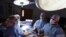  Dr. Keith Melancon, right, Georgetown's kidney transplant director, performs the surgery to harvest the kidney from a donor in Washington.