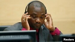 FILE - Germain Katanga, a Congolese national, sits in the courtroom of the ICC during the closing statements in the trial against Katanga and Ngudjolo Chui in The Hague.