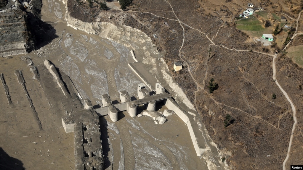 An aerial view shows a damaged barrage after a flash flood swept a mountain valley destroying dams and bridges, in Tapovan in the northern state of Uttarakhand, India, Feb. 12, 2021. 