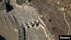 An aerial view shows a damaged barrage after a flash flood swept a mountain valley destroying dams and bridges, in Tapovan in the northern state of Uttarakhand, India, Feb. 12, 2021. 