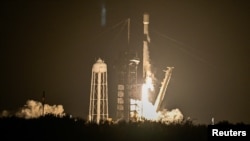 A SpaceX Falcon 9 rocket launches carrying Firefly Aerospace's Blue Ghost lunar lander as the primary payload and Japan-based ispace's Resilience lander as a secondary payload, from Kennedy Space Center in Cape Canaveral, Florida, Jan. 15, 2025.