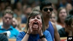 FILE- In this Oct. 19, 2017 file photo, a protester shouts down White Nationalist Richard Spencer during a speech at the University of Florida in Gainesville, Fla. Florida Republicans are…