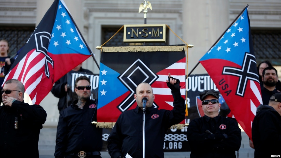 Commander Jeff Schoep of the National Socialist Movement, one of the largest white nationalist type groups in the country, speaks during a rally at the state capital in Little Rock, Arkansas, Nov. 10, 2018. 
