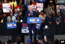 FILE - Democratic presidential candidate former Vice President Joe Biden speaks during a campaign rally at Renaissance High School in Detroit, Michigan, March 9, 2020.