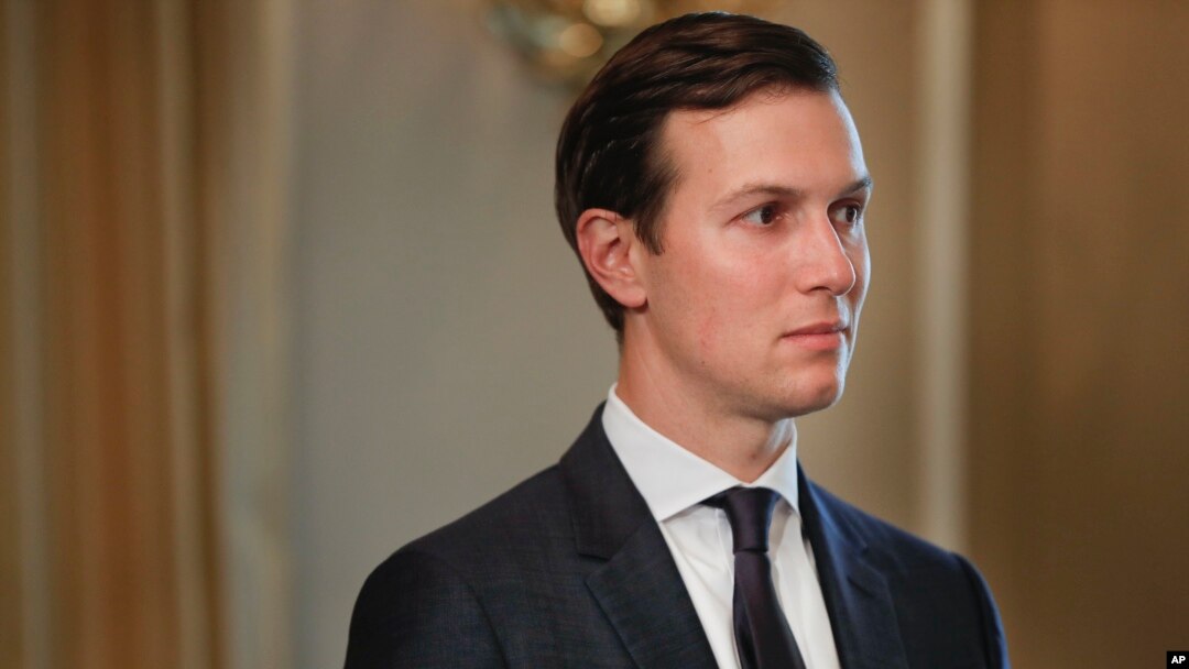 FILE - White House senior adviser Jared Kushner listens as President Donald Trump answers reporters' questions at Trump National Golf Club in Bedminster, N.J., Aug. 11, 2017.