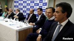 FILE - Sao Paulo's Mayor Joao Doria (2nd R) attends a meeting of the Brazilian Social Democracy Party (PSDB) in Brasilia, Brazil, June 12, 2017. 