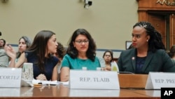 FILE - From l-r., Rep. Alexandria Ocasio-Cortez, D-NY., Rep. Rashida Tlaib, D-Mich., and Rep. Ayanna Pressley, D-Mass., wait to testify before the House Oversight Committee hearing on family separation and detention centers, July 12, 2019. 