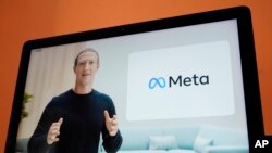 FILE - Seen on the screen of a device in Sausalito, Calif., Facebook CEO Mark Zuckerberg talks about Meta, during a virtual event, Oct. 28, 2021. 