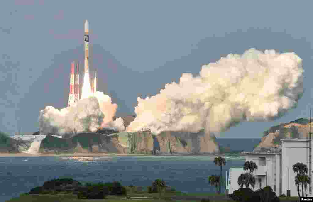 n H-2A rocket carrying Japan Meteorological Agency's new weather satellite "Himawari-9" is launched at Tanegashima Space Center on the Japanese southwestern island of Tanegashima, Kagoshima Prefecture, in this photo taken by Kyodo.