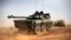 A French tank is seen heading north at the tail end of a 60-plus military convoy in Gao, northern Mali, February 6, 2013. 