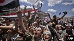 Anti-government protesters shout slogans during a demonstration demanding the resignation of Yemeni President Ali Abdullah Saleh, in Sana'a, Yemen, April 25, 2011