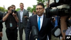Assistant Attorney General Makan Delrahim leaves the federal courthouse, June 12, 2018, in Washington.