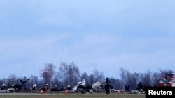 Wreckage is seen at the site of a Tatarstan Airlines Boeing 737 crash at Kazan airport, russia, Nov. 18, 2013. 