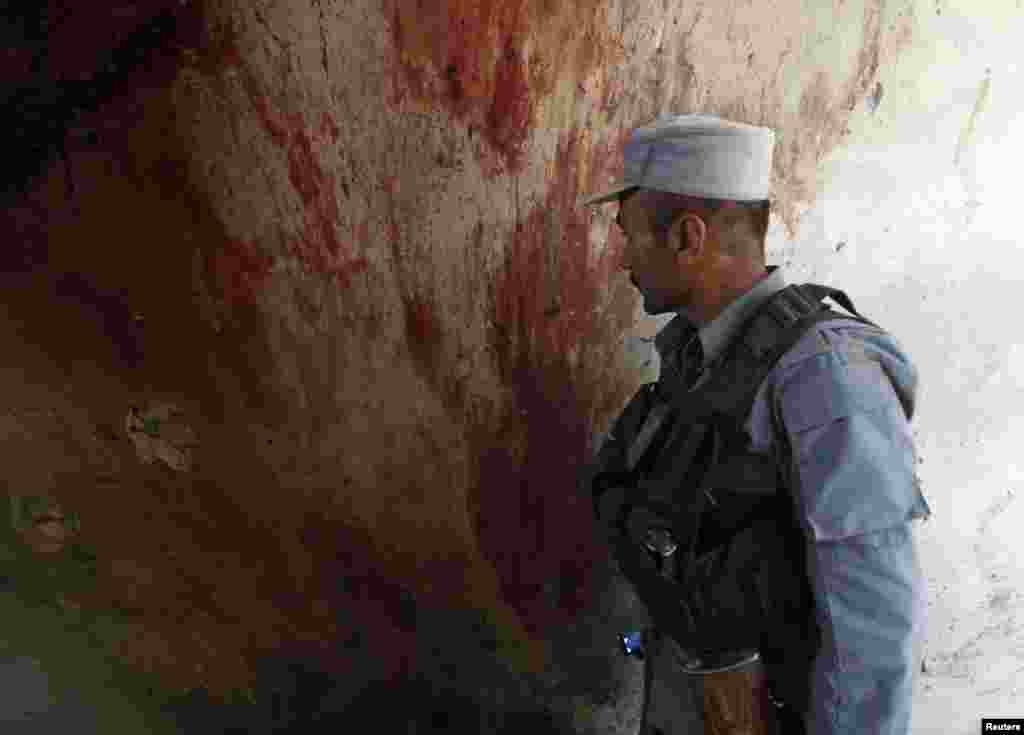 Blood is seen on the wall of a building after an attack in Kabul, June 10, 2013. 