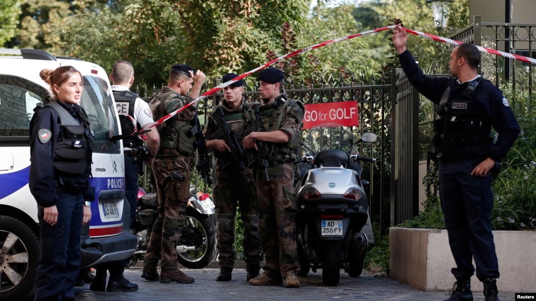 Police and soldiers secure the scene where French soliders were hit and injured by a vehicle in the western Paris suburb of Levallois-Perret, France, Aug. 9, 2017. 