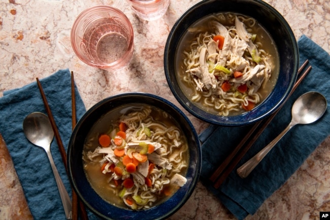 This image shows a recipe for chicken ramen noodle soup. (Cheyenne M. Cohen/Katie Workman via AP)