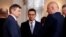 Poland's Prime Minister Mateusz Morawiecki speaks with Marek Kuchcinski, left, speaker of parliament, and Joachim Brudzinski, newly sworn-in Interior Minister, after a ceremony at Presidential Palace in Warsaw, Jan. 9, 2018. 