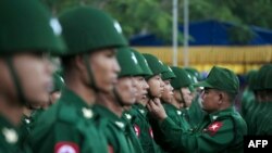 (FILES) In this file photo taken on February 12, 2020, members of the Myanmar military honour guard take part in a ceremony to mark the 73rd National Union Day in Yangon. - Myanmar's army chief has raised on January 27, 2021 the prospect of scrapping the 