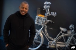 Michael Musandu, a co-founder and CEO of AI fashion company Lalaland.ai, poses for a portrait in Amsterdam, Netherlands, Friday, March 8, 2024. (AP Photo/Peter Dejong)