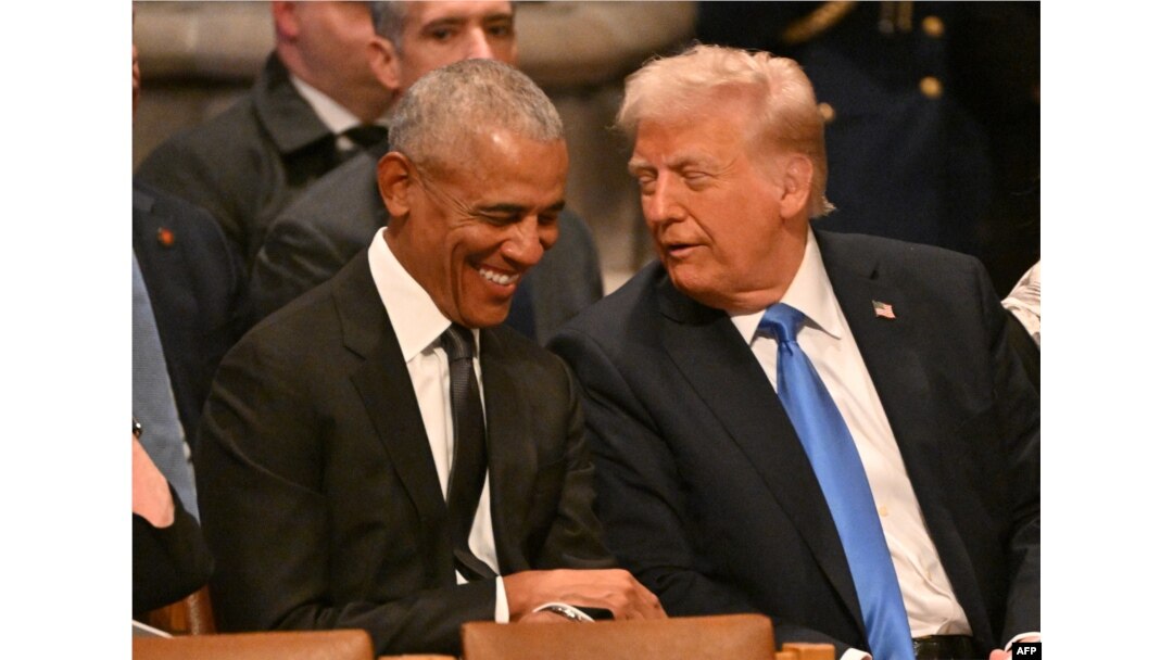 Former U.S. President Barack Obama speaks with President-elect Donald Trump before the funeral service for former U.S. President Jimmy Carter at the Washington National Cathedral in Washington on Jan. 9, 2025.