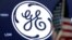 The General Electric logo appears above a trading post on the floor of the New York Stock Exchange, June 26, 2018. 
