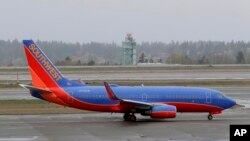 FILE - A Southwest Airlines plane taxis at the Seattle-Tacoma International Airport in Seattle, April 13, 2018.