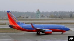 FILE - A Southwest Airlines plane taxis at the Seattle-Tacoma International Airport in Seattle, April 13, 2018.