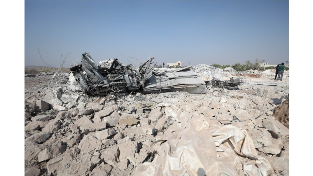 A destroyed vehicle at the site where helicopter gunfire reportedly killed nine people near the northwestern Syrian village of Barisha in the Idlib province, Oct. 27, 2019.