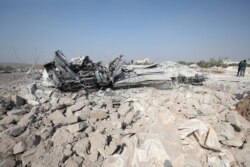 A destroyed vehicle at the site where helicopter gunfire reportedly killed nine people near the northwestern Syrian village of Barisha in the Idlib province, Oct. 27, 2019.