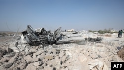A destroyed vehicle at the site where helicopter gunfire reportedly killed nine people near the northwestern Syrian village of Barisha in the Idlib province, Oct. 27, 2019.