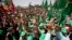 FILE - Palestinian students and supporters of the Hamas movement chant slogans during a rally near the West Bank city of Ramallah, April 26, 2016.