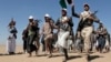 (FILE) Houthi rebel fighters march during a rally of support for the Palestinians in the Gaza Strip and against the U.S. strikes on Yemen outside Sanaa on Jan. 22, 2024.