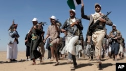 (FILE) Houthi rebel fighters march during a rally of support for the Palestinians in the Gaza Strip and against the U.S. strikes on Yemen outside Sanaa on Jan. 22, 2024.