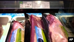 Packages of beef imported from Australia are on sale at a supermarket in Beijing, Friday, May 15, 2020.
