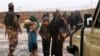 FILE - Syrian refugees are seen at Rukban camp, located in a no-man's-land on the border between Syria and Jordan, March 1, 2017