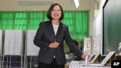 FILE - Taiwanese President and presidential election candidate Tsai Ing-wen casts her ballot at a polling station in New Taipei City, Taiwan, Jan. 11, 2020.