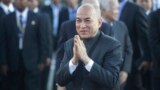 Cambodia's King Norodom Sihamoni, center, greets his government officials upon his arrival for the water festival in front of Royal Palace in Phnom Penh, Cambodia, Sunday, Nov. 13, 2016. The three-day annual festival, started Sunday, dedicates to the kingdom's ancestral naval warriors. (AP Photo/Heng Sinith)