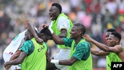 Senegalese players celebrate after Lamine Camara scored their team's third goal during the Africa Cup of Nations 2024 group C football match against Gambia at Stade Charles Konan Banny in Yamoussoukro on January 15, 2024.