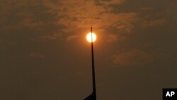 The sun, muted by smoke, is visible in Portland, Ore., Sept. 5, 2017. Dozens of fires across the Western U.S. and Canada blanketed the air with choking smoke from Oregon to Colorado, where health officials issued air quality alerts.