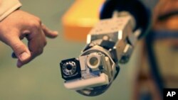 Toshiba Corporation unveiled a pan-tilt camera developed by the Toshiba Corp. and the International Research Institute for Nuclear Decommissioning (IRND), designed to inspect the interior of the damaged primary containment vessel of the Fukushima Dai-ichi Nuclear Power Station in Yokohama, Dec. 22, 2017.