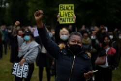 FILE - Thousands of people demonstrate in support of the Black Lives Matter movement in a park in Amsterdam, June 10, 2020.