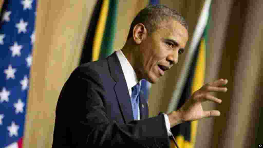 U.S. President Barack Obama gestures during a news conference with South African President Jacob Zuma.