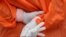 A health worker holds a glove outside the San Jose public hospital emergencies entrance, amid the spread of the coronavirus disease (COVID-19) in Santiago, Chile, May 28, 2020. 
